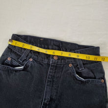 Load image into Gallery viewer, Vintage Levi's black 550 fit jean shorts 23 inch waist